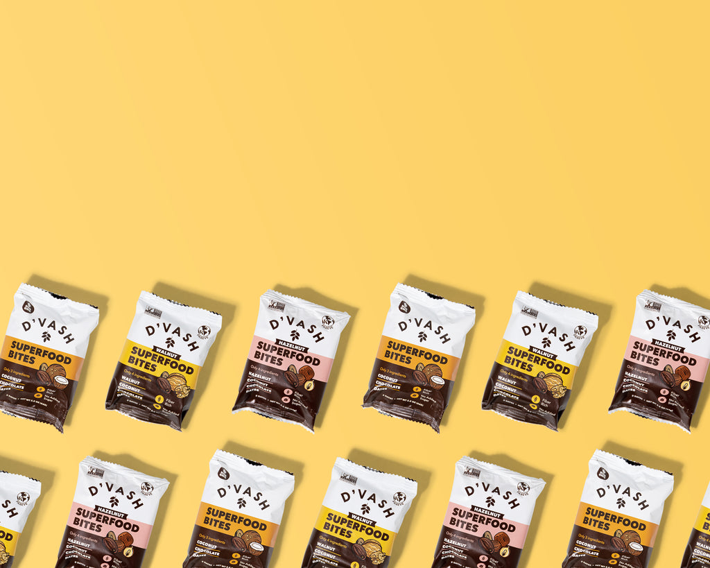 Delicious and healthy date bars made with D'vash Organics date syrup, perfect for a quick snack on yellow background