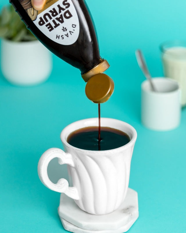 date syrup being used as a sweetener in coffee / tea
